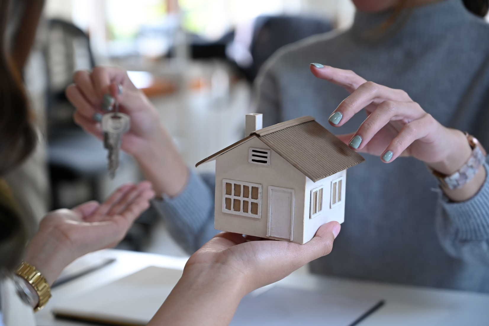 Cropped Image of Real Estate Agent Offering Home Ownership to Co